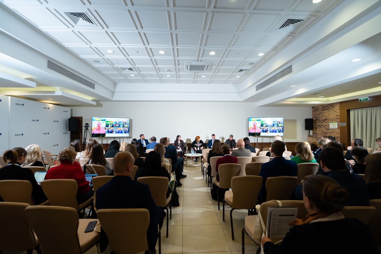 People a sitting in a conference room